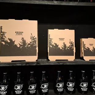 three boxes of beer on a shelf