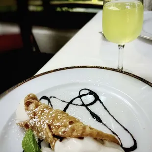 a plate of food and a glass of wine