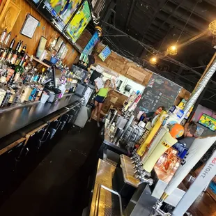 a bar with a large television screen