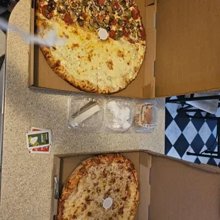 Zein Supreme and White pizza, a menagerie of desserts and a cheese pizza.