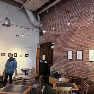 a man standing in a coffee shop