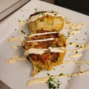 two crab cakes on a white plate