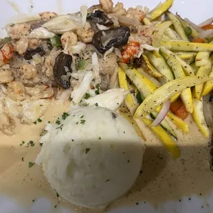 fish of the day with crawfish and crab on top