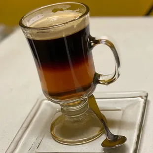 a cup of coffee with a spoon