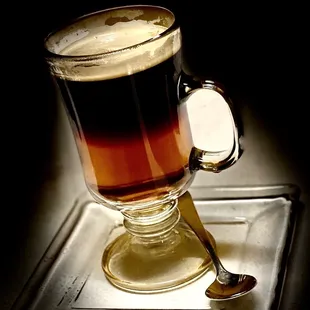 a cup of coffee on a tray