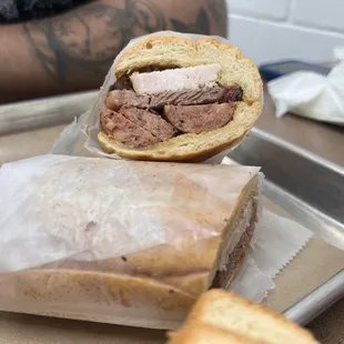 a beef sandwich with a side of ketchup