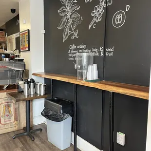 a coffee shop with a chalkboard wall