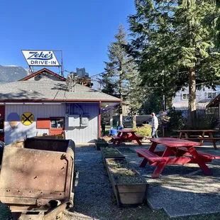 Picnic tables outside dinning . They also have inside seating