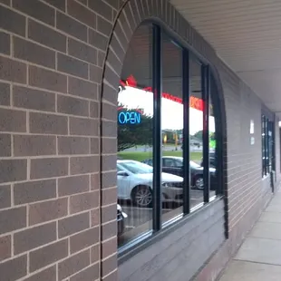 the reflection of a car in the window