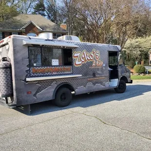 a food truck parked on the side of the road