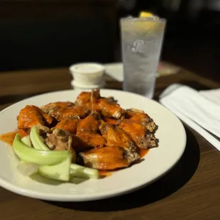 Wings! Extra hot sauce is homemade.