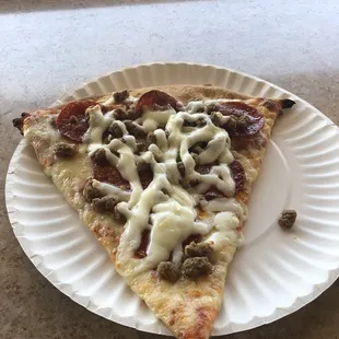 $2.75 for me slice of "extra" cheese, tasteless pepperoni, and frozen tasteless sausage crumbles.