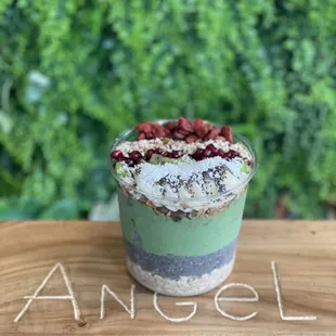 a cup of ice cream with berries on top