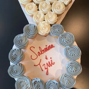 a cake with cupcakes on it