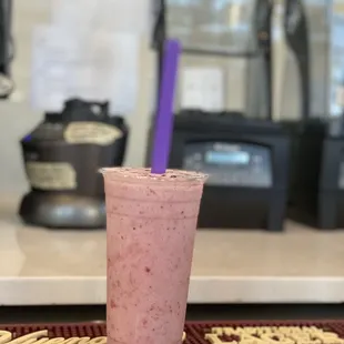 a smoothie in a plastic cup