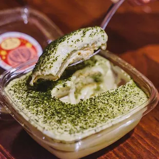 a spoon with a spoonful of pesto dip
