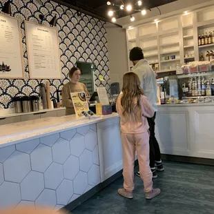 two people standing at the counter