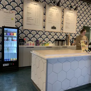 a woman standing at the counter