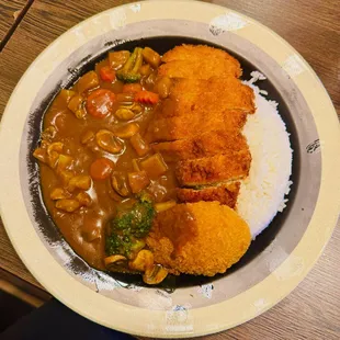 medium curry with chicken, vegetables, croquet, rice, and 30 cents for 7 heat
