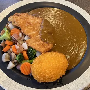 Chicken Katsu Curry with veggies, and croquette