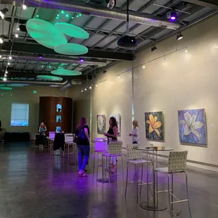 Art exhibition in one of the rooms. Cool lighting adds impactq