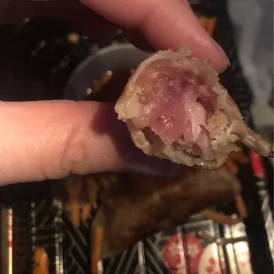 Potstickers aren't supposed to be raw.