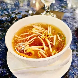 a bowl of soup on a plate