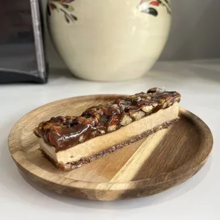a piece of cake on a wooden plate