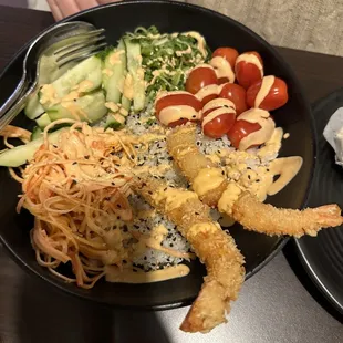 Poke bowl with sushi rice, tempura shrimp, crab, cucumber, sprouts, tomatoes and spicy mayo