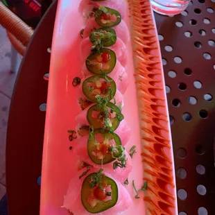 a long rectangular plate of sushi