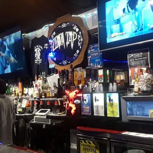 a man standing in front of the bar