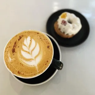 a cup of coffee and a doughnut