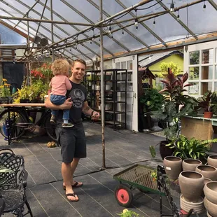 Indoor area for ferns, decor, and checking out.