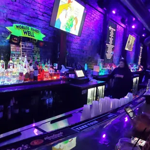 a bar filled with bottles of alcohol