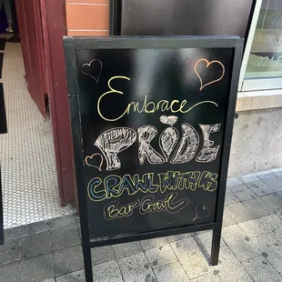 a sign that says embrace and ride