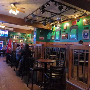 people sitting at tables in a restaurant