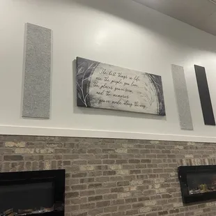 a brick wall and fireplace