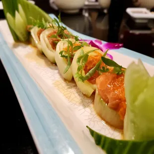 Cajun salmon and garlic tuna cucumber roll. Translate text with your camera  bello e delizioso