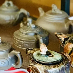 a variety of teapots on display