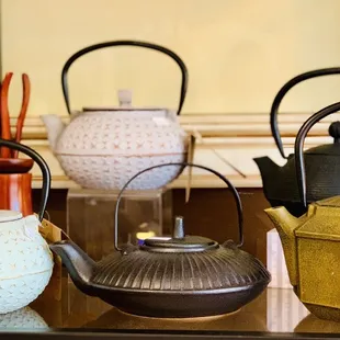 a variety of teapots on display