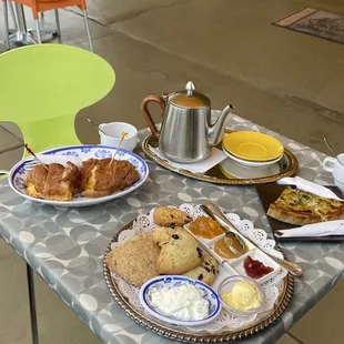 a table with a variety of breakfast foods on it