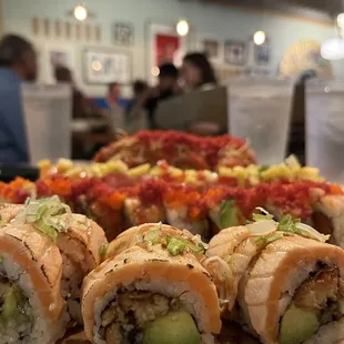a plate of sushi rolls