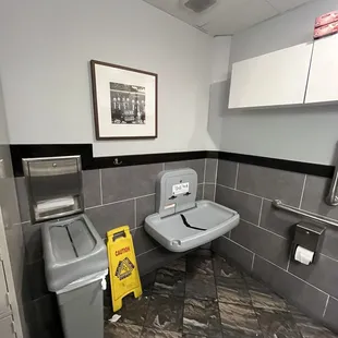 a sink and trash can