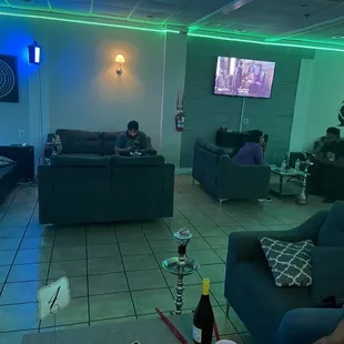 people sitting on couches and watching tv