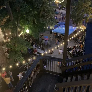 View of outdoor music at night from the third floor outdoor patio