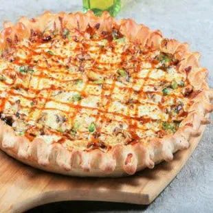 a pizza on a wooden board