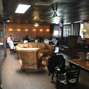 Large area with couches, booths and tables.