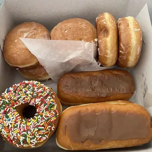 Jelly filled, custard filled, glazed and sprinkled.