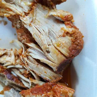 a plate of meat with sauce