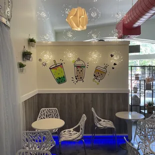 a coffee shop with tables and chairs